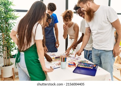 Group Of People Smiling Happy Drawing Standing Around The Table At Art Studio.