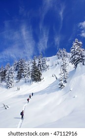 A Group People Are Snowshoeing, Trying To Cross The Snow Mountain In BC, Canada.