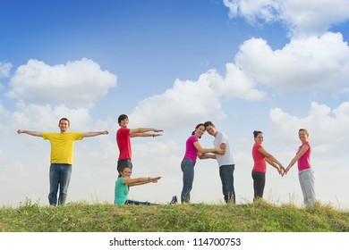 Group of people spelling word TEAM outdoors in nature - Shutterstock ID 114700753