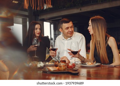Group Of People Spend Time At A Fancy Restaurant