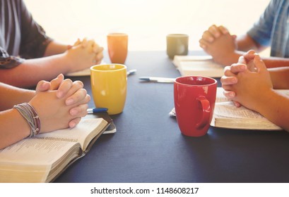 A Group Of People Studying The Bible Outside