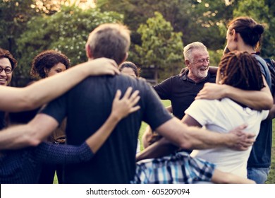 Group of people support unity arm around together - Shutterstock ID 605209094
