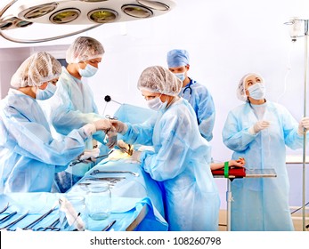 Group people surgeon at work in operating room. - Powered by Shutterstock