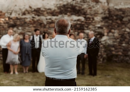 Similar – Woman in wedding dress with two men on a rope