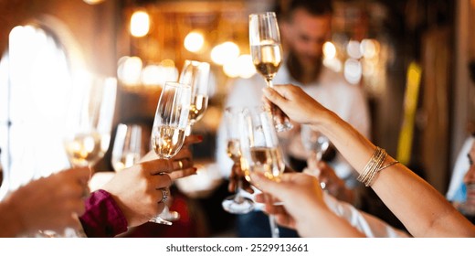 Group of people toasting with champagne glasses at a celebration. Hands holding champagne, clinking glasses. Festive atmosphere, joyful celebration, champagne toast. People toasting with champagne. - Powered by Shutterstock