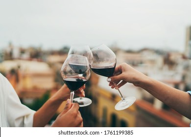 Group Of People Toasting Outside, Best Friends Celebrating At Rooftop Party, Young Friends Hanging Out With Drinks, Close Up Shot Of People Making Cheers, Summer Rooftop Party Concept