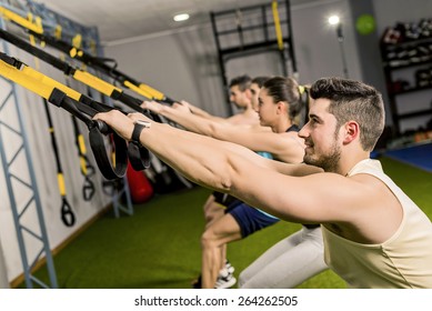 Group Of People Training In Elastic Rope At Modern Gym