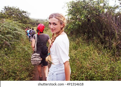 Group Of People Trekking On Dirt Road In Galapagos Island