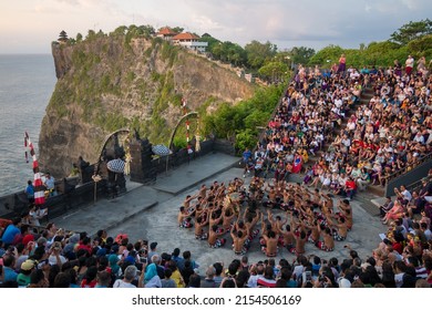 A group of people at the Uluwatu Temple and Kecak Tradition Fire Dance in Bali, Indonesia