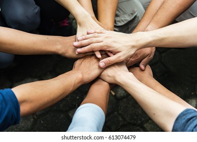 Group of people United Hands to built teamwork together with Spirit - teamwork concepts.