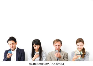 Group Of People Using Smart Phones.