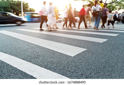 Group Of People Walking On The Crosswalk.