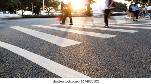 Group Of People Walking On The Crosswalk.