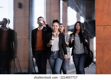 Group Of People Walking On A Street With Confidence. Businessmen And Businesswomen Traveling Together.