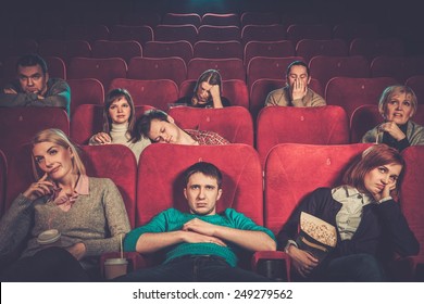 Group Of People Watching Boring Movie In Cinema