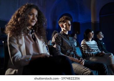 Group Of People Watching Movie In Cinema Or Listening To Presentation At Conference.