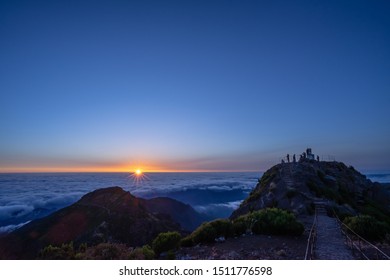 A Group Of People Watching Sunrise At The Highest Peak Of Madeir