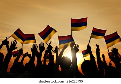 Group Of People Waving Armenian Flags In Back Lit