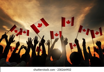 Group Of People Waving Canadian Flag