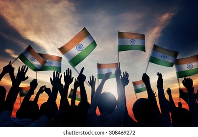 Group Of People Waving Indian Flags In Back Lit