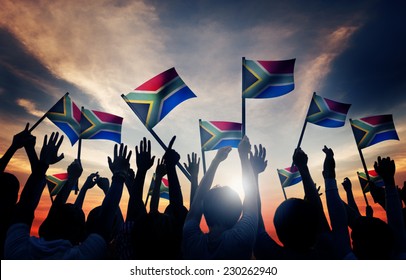 Group of People Waving South African Flags in Back Lit - Shutterstock ID 230262940