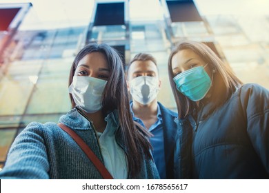 Group Of People Wearing Mask Taking Selfie Outside.