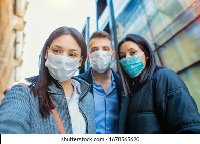 Group Of People Wearing Mask Taking Selfie Outside.