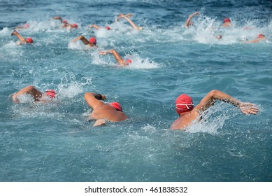 Group People In Wetsuit Swimming At Triathlon