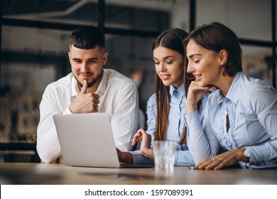 Group Of People Working Out Business Plan In An Office