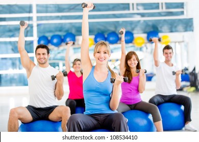 Group Of People Working Out At The Gym