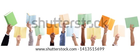 Group Of People's Hand Holding Colorful Books Against Isolated On White Background