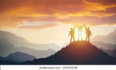 Group of peoples on mountains top in winner pose. Leadership Concept - Shutterstock ID 1393769198