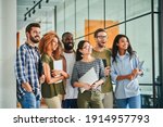 Group photo of thrilled young people with laptops