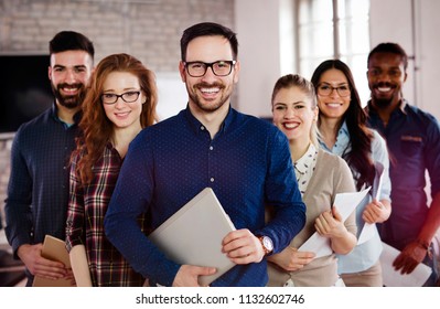 Group Picture Of Team Of Successful And Confident Designers