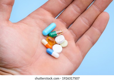 Group of pills in a hand. Medicine concept