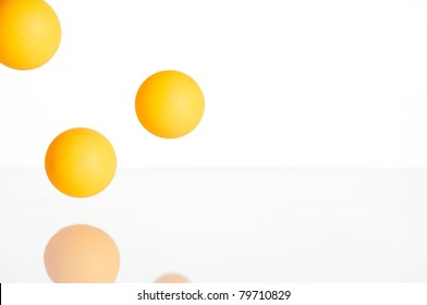 Group Of Ping Pong Balls In White Background Jumping