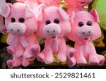 group of pink stuffed animal carnival prizes