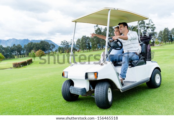 Group of players\
in a golf cart at the course\
