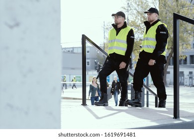 Group Of Police Officers Heading For Intervention On The City Streets