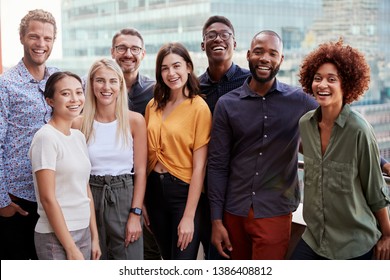 Group Portrait Of A Creative Business Team Standing Outdoors, Three Quarter Length, Close Up