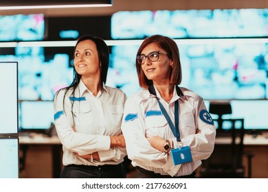 Group Portrait Of Female Security Operator While Working In A Data System Control Room Offices Technical Operator Working At Workstation With Multiple Displays, Security Guard Working On Multiple Mon