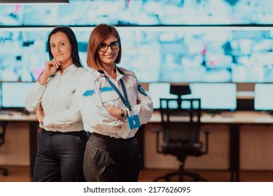 Group Portrait Of Female Security Operator While Working In A Data System Control Room Offices Technical Operator Working At Workstation With Multiple Displays, Security Guard Working On Multiple Mon