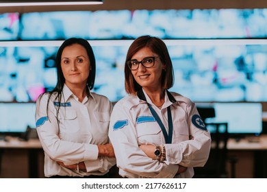 Group Portrait Of Female Security Operator While Working In A Data System Control Room Offices Technical Operator Working At Workstation With Multiple Displays, Security Guard Working On Multiple Mon