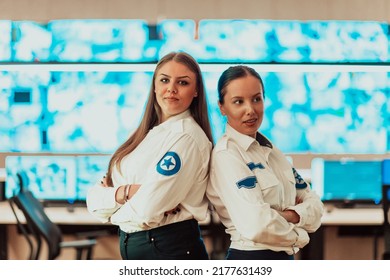 Group Portrait Of Female Security Operator While Working In A Data System Control Room Offices Technical Operator Working At Workstation With Multiple Displays, Security Guard Working On Multiple Mon