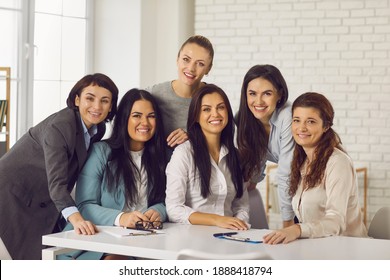 Group Portrait Of Happy Successful Beautiful Business Women In Company Office Meeting. Team Of Positive Young Female Professionals In Their 20s And 30s Smiling And Looking At Camera All Together