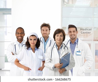 Group Portrait Of Medical Staff At Clinic, Looking At Camera, Smiling.