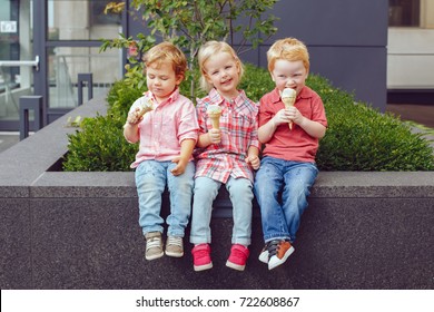 Group Portrait Of Three White Caucasian Cute Adorable Funny Children Toddlers Sitting Together Sharing Ice-cream Food. Love Friendship Fun Concept. Best Friends Forever. 