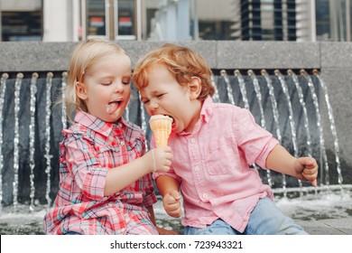 Group Portrait Of Two White Caucasian Cute Adorable Funny Children Toddlers Sitting Together Sharing Ice-cream Food. Love Friendship Concept. Best Friends Forever. 