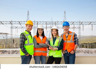 Group Portrait Of Young Workers In Electric Power Station