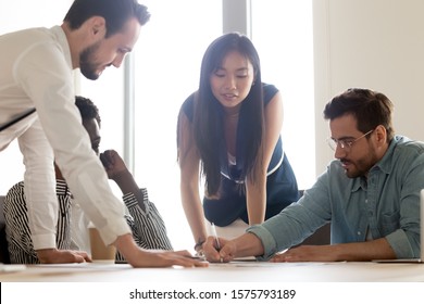 Group Of Positive Multiracial Colleague Gathered Together In Boardroom Working On Common Business Project Financial Component Capital Requirements, Manage Finance Planning Profits Do Paperwork Concept